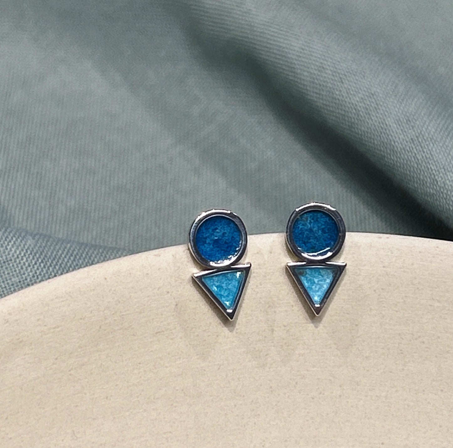 The circle and triangle studs